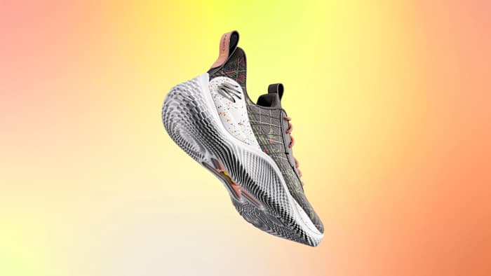 View of grey and white Curry shoes.